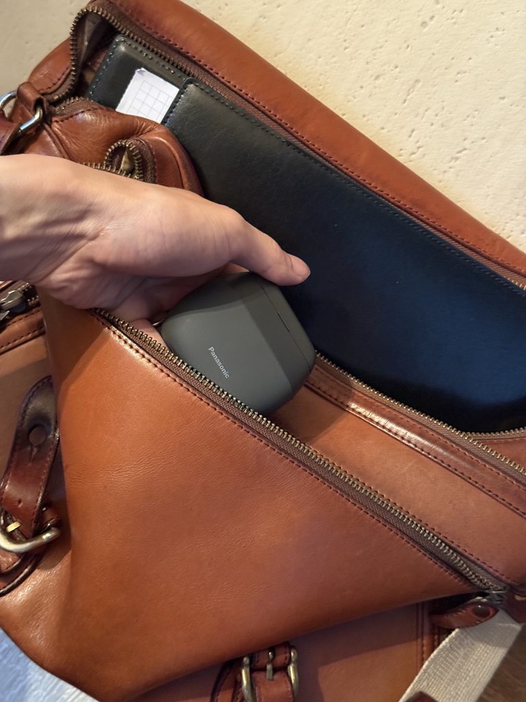 Panasonic LAMDASH PALM IN compact shaver inside a work bag