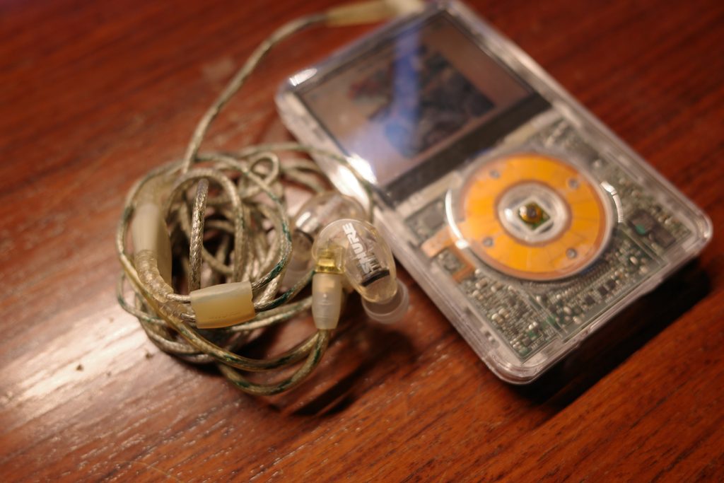 Transparent iPod Classic connected to Shure SE215 Clear earphones
