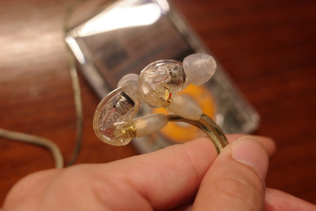 Listening to music on an iPod Classic with Shure SE215 earphones